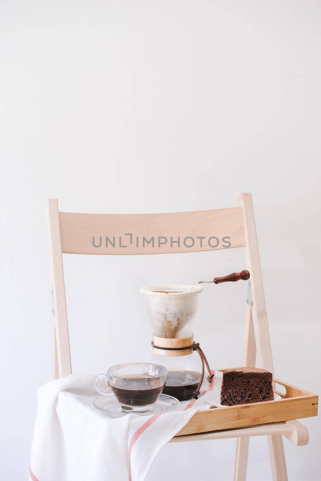 Serving hot coffee in the living room of his home in the morning