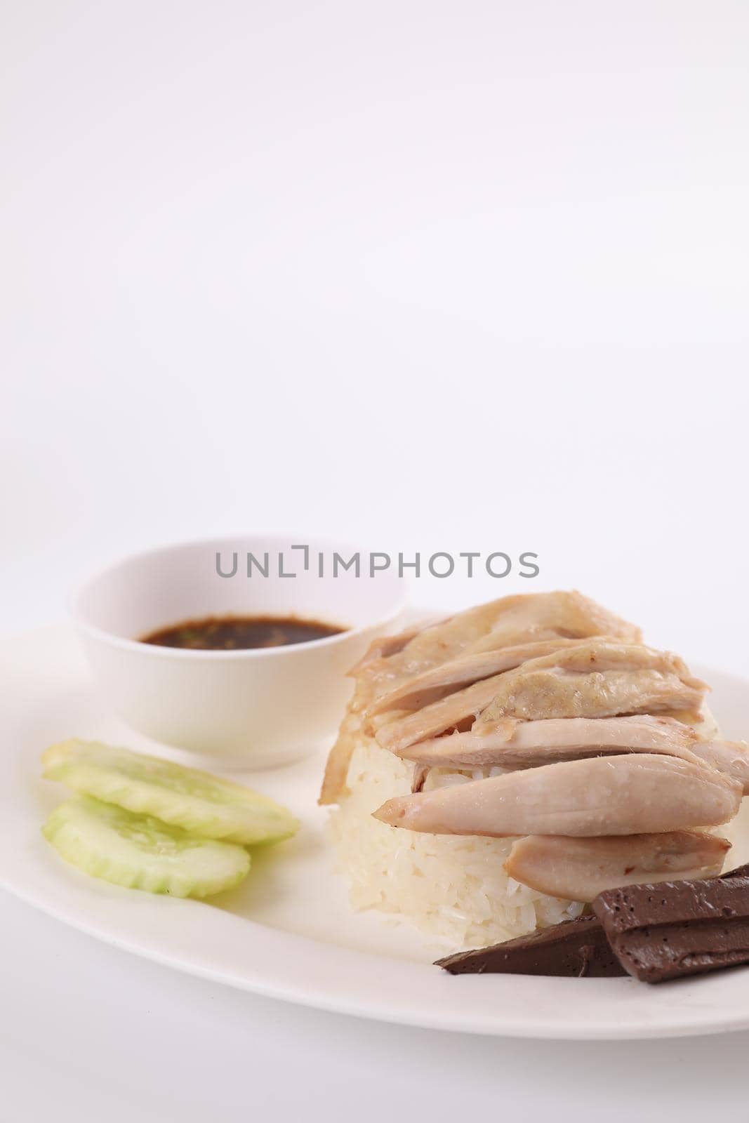 Thai food gourmet steamed chicken with rice , khao mun kai in wood background 