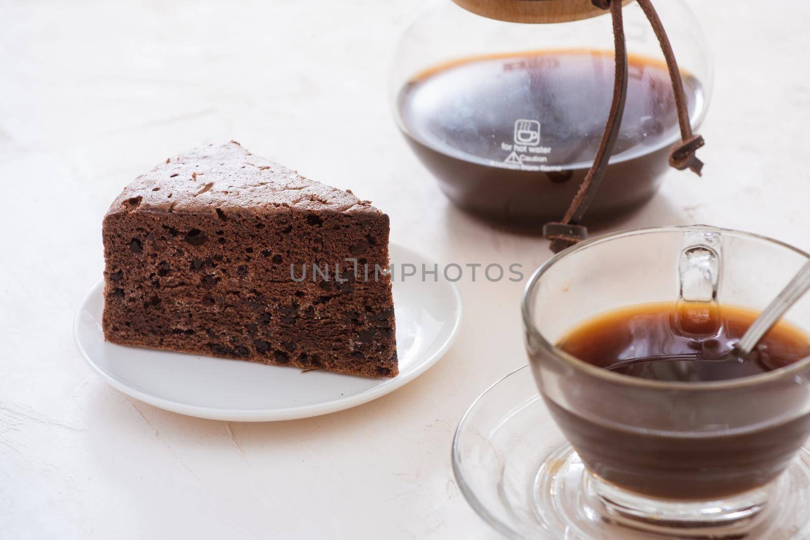 Drip coffee (dripper) and drip ground coffee with glass drip pot, cup and chocolate cake by makidotvn