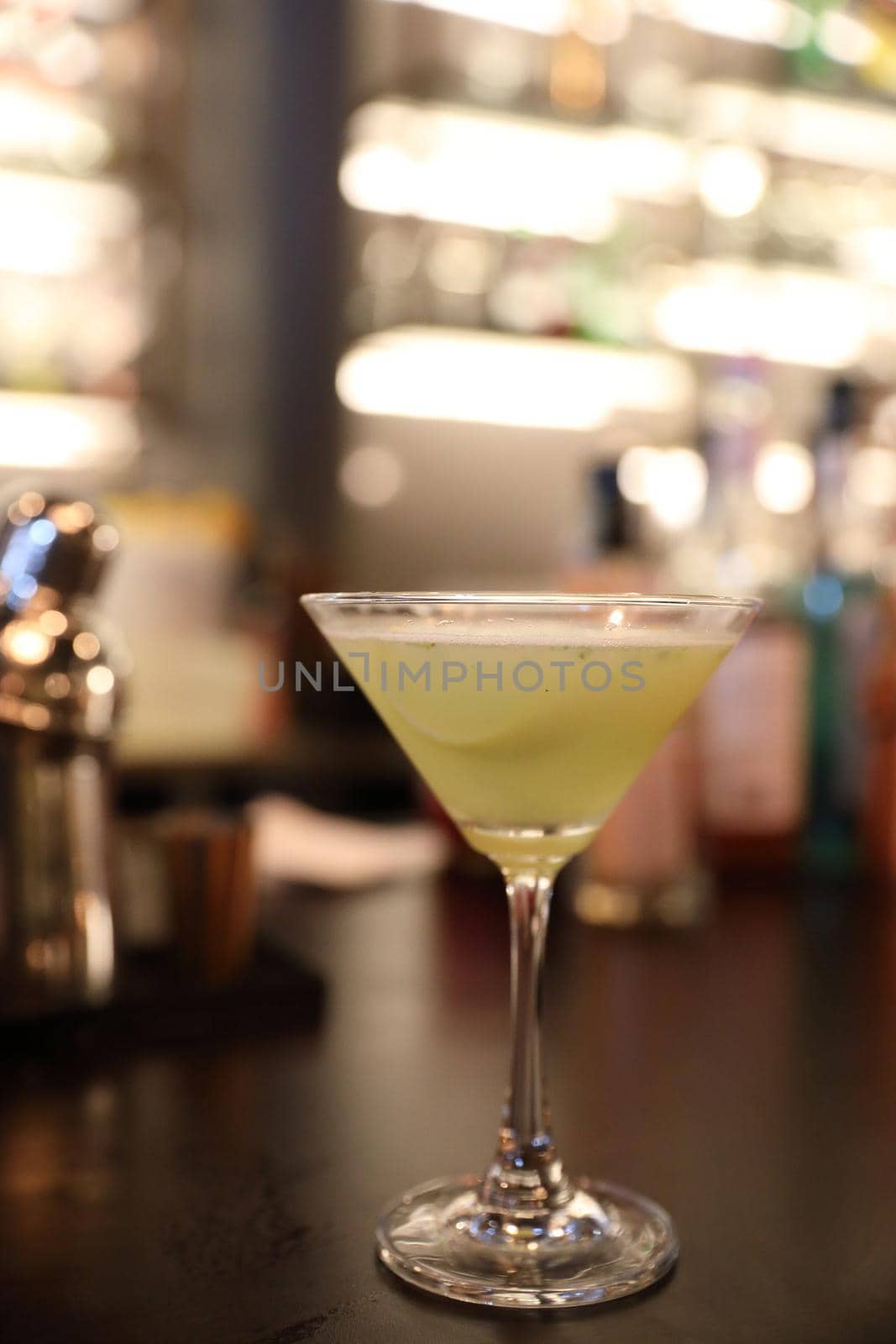 cocktails in glasses on bar counter in pup or restaurant