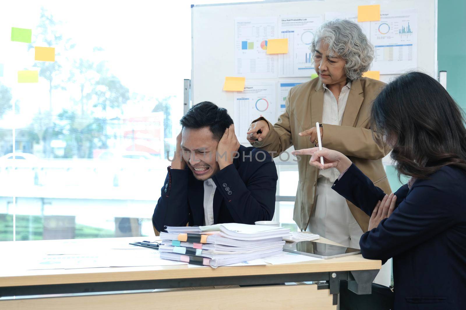 Stressed annoyed office employee having headache migraine at business finance meeting.