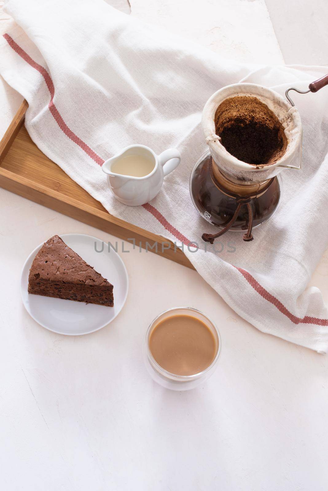 Breakfast with chocolate cake and coffee served on a beautiful living home 