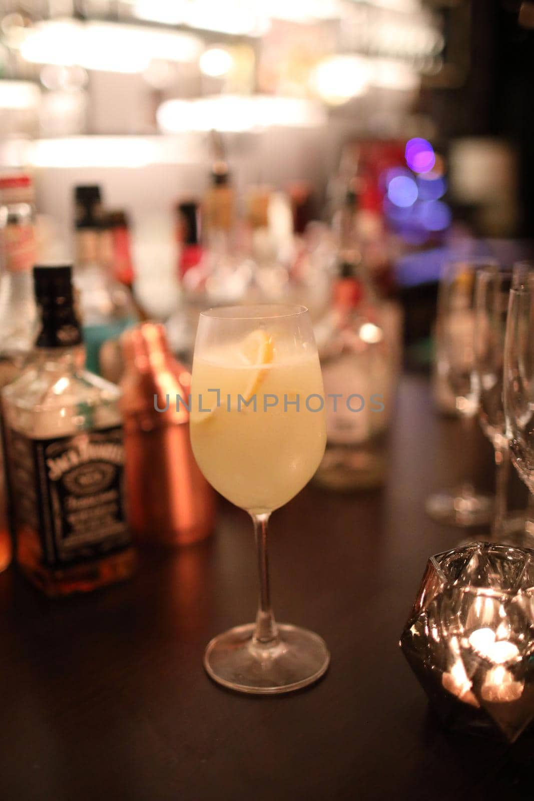 cocktails in glasses on bar counter in pup or restaurant