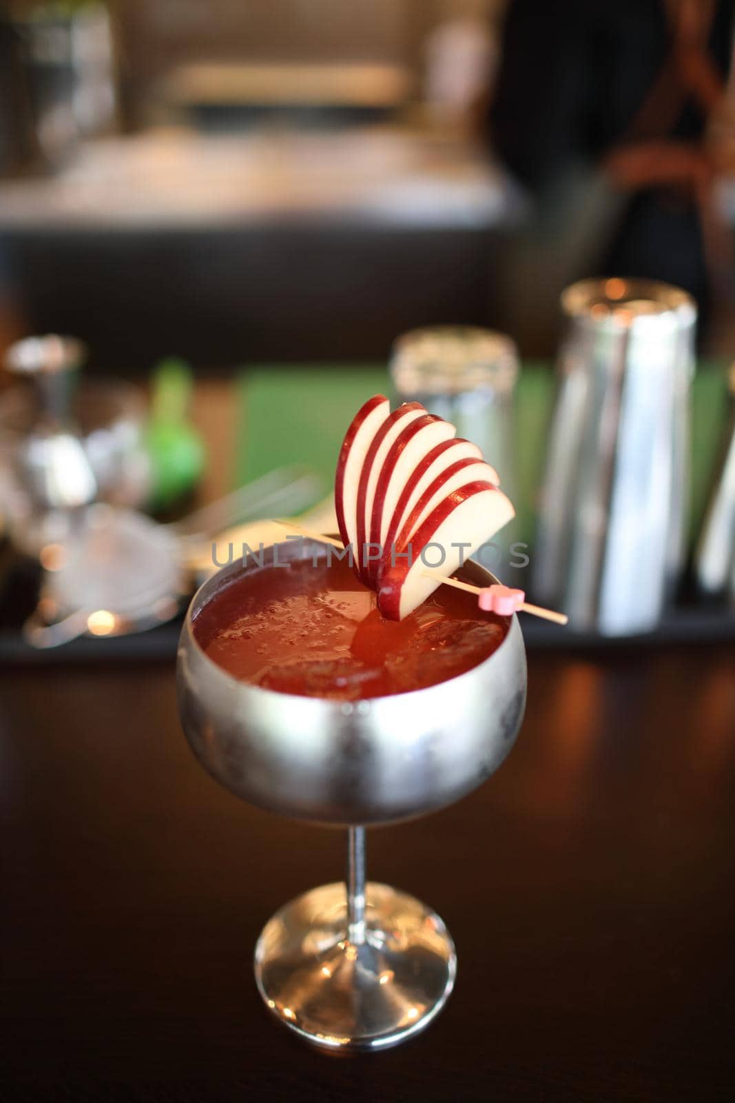 cocktails in glasses on bar counter in pup or restaurant