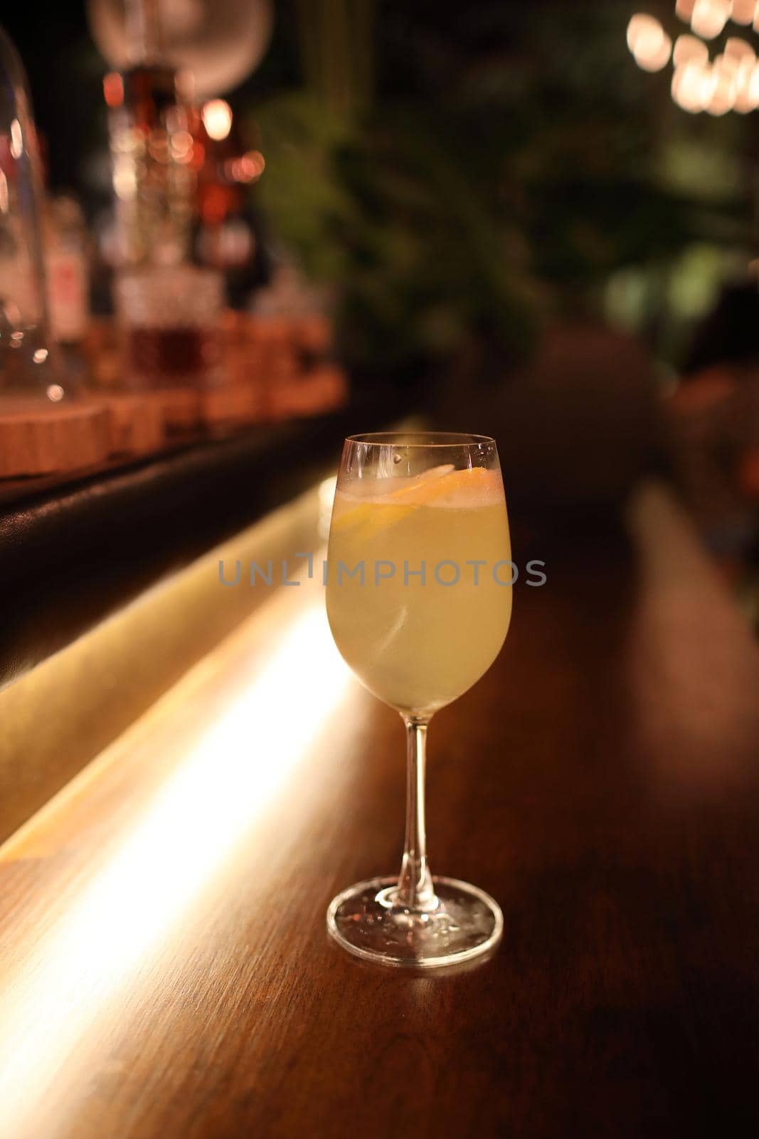 cocktails in glasses on bar counter in pup or restaurant