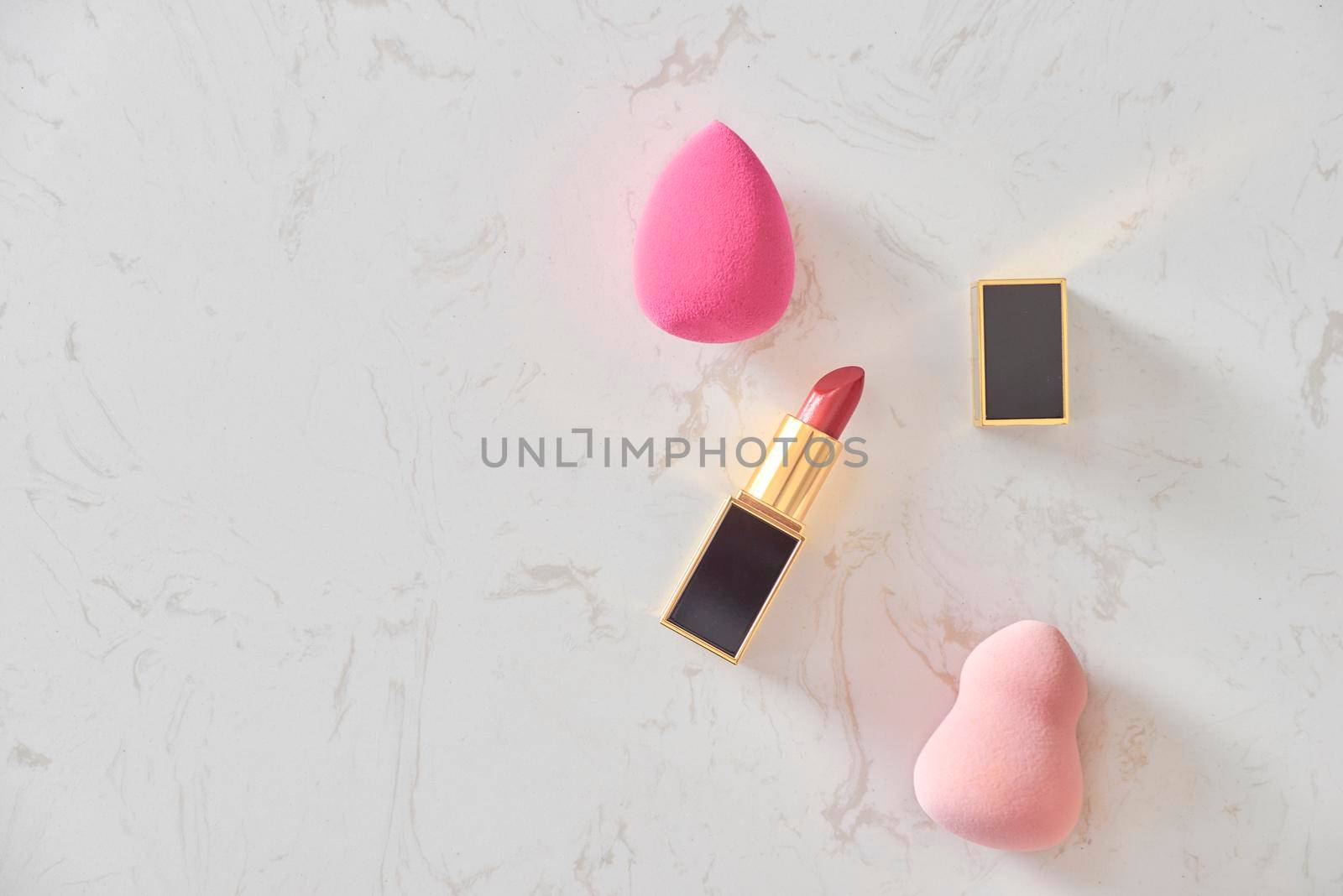 Feminine cosmetic background. Overhead of essentials of a modern woman. Cosmetic objects frame by makidotvn
