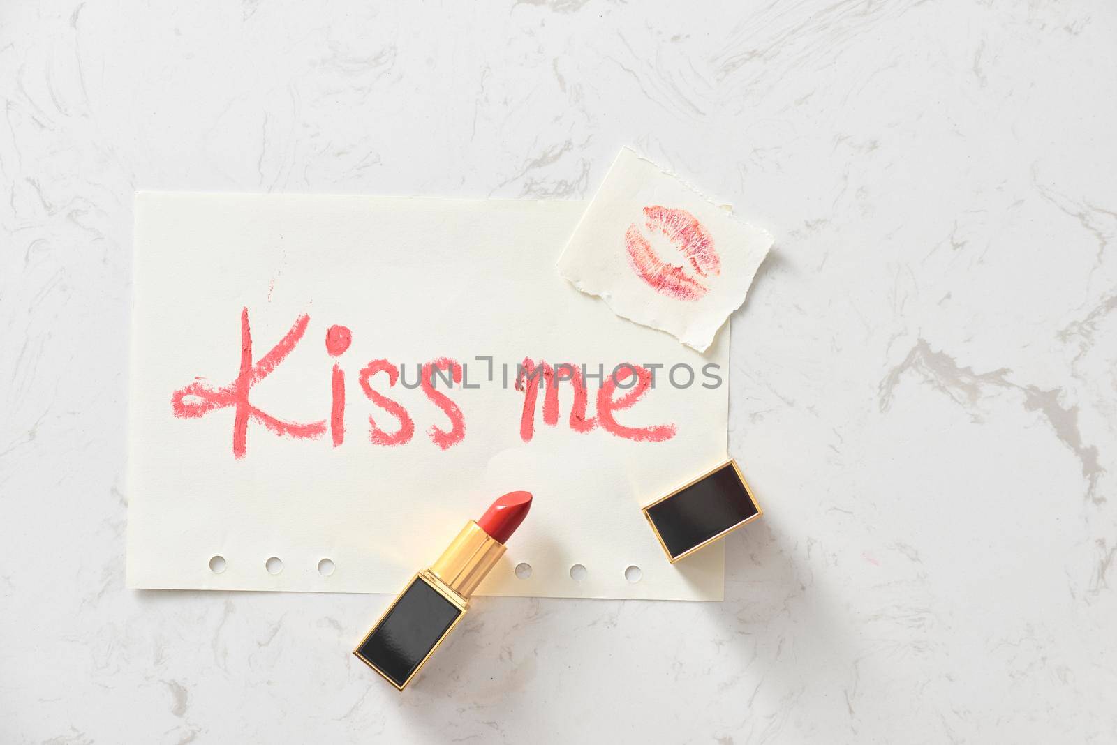a kiss on a white background lipstick. selective focus.