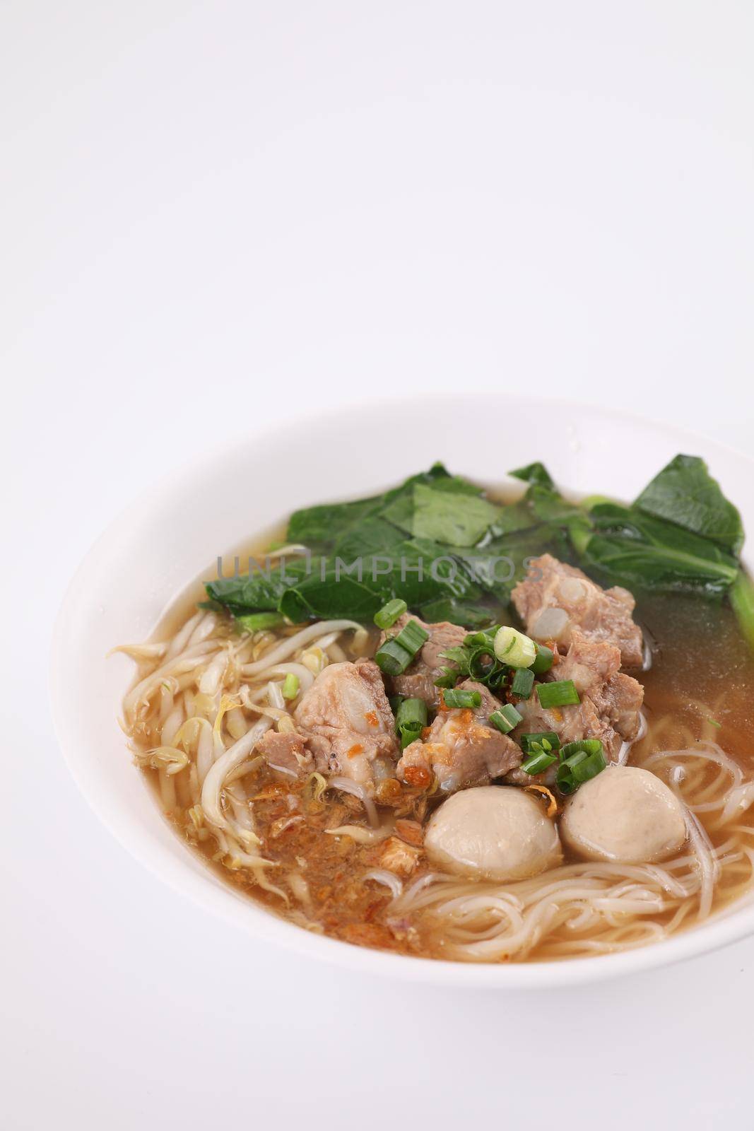 Local Thai food , Noodle with meat ball and pork isolated in white background by piyato