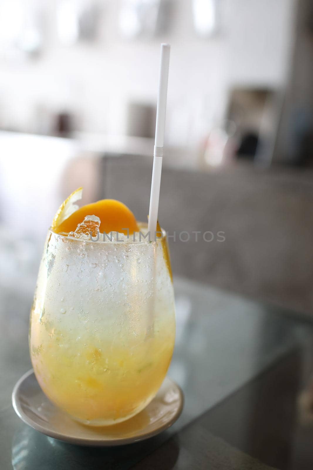 Yellow Cocktail glass with ice by piyato