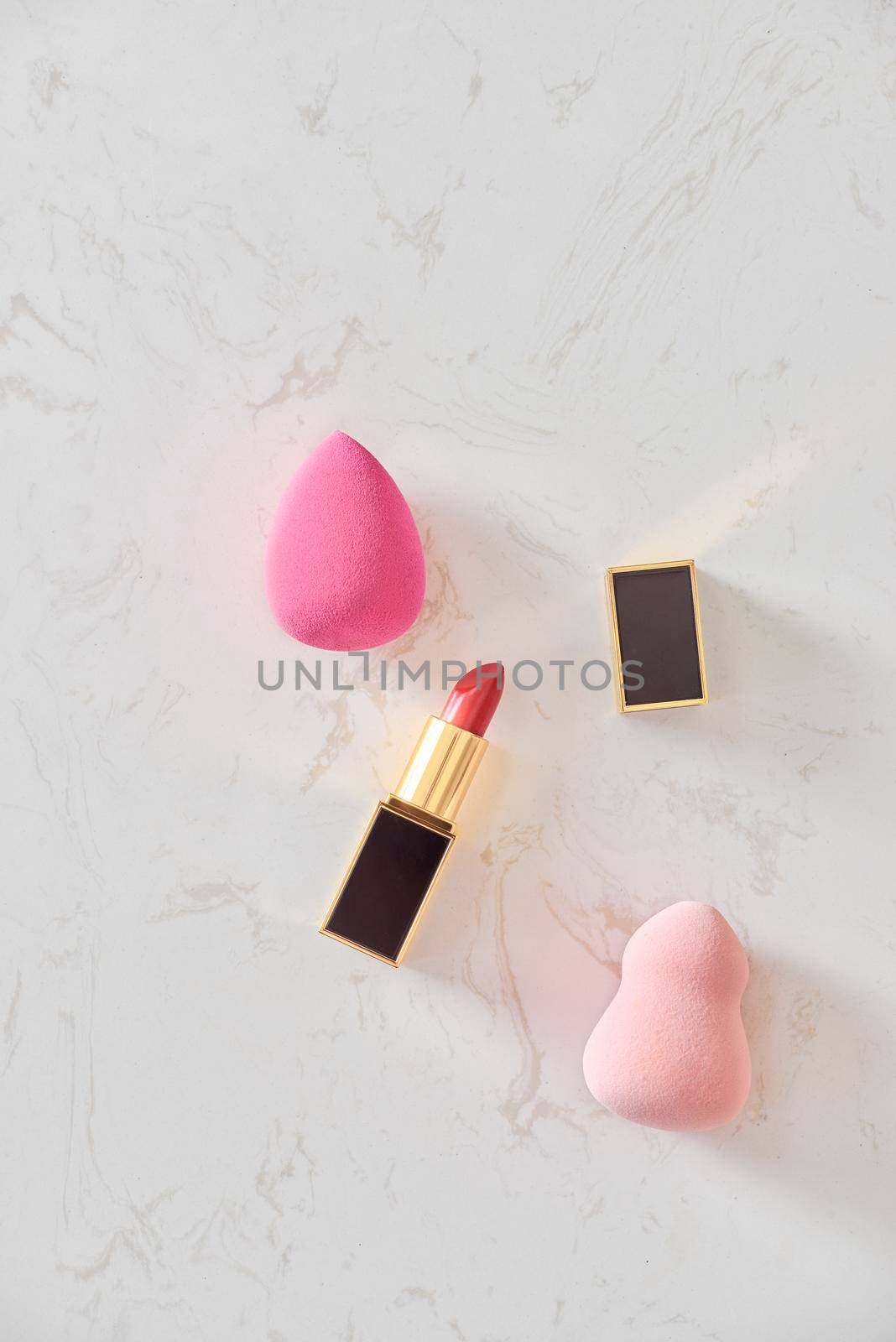 Feminine cosmetic background. Overhead of essentials of a modern woman. Cosmetic objects frame by makidotvn