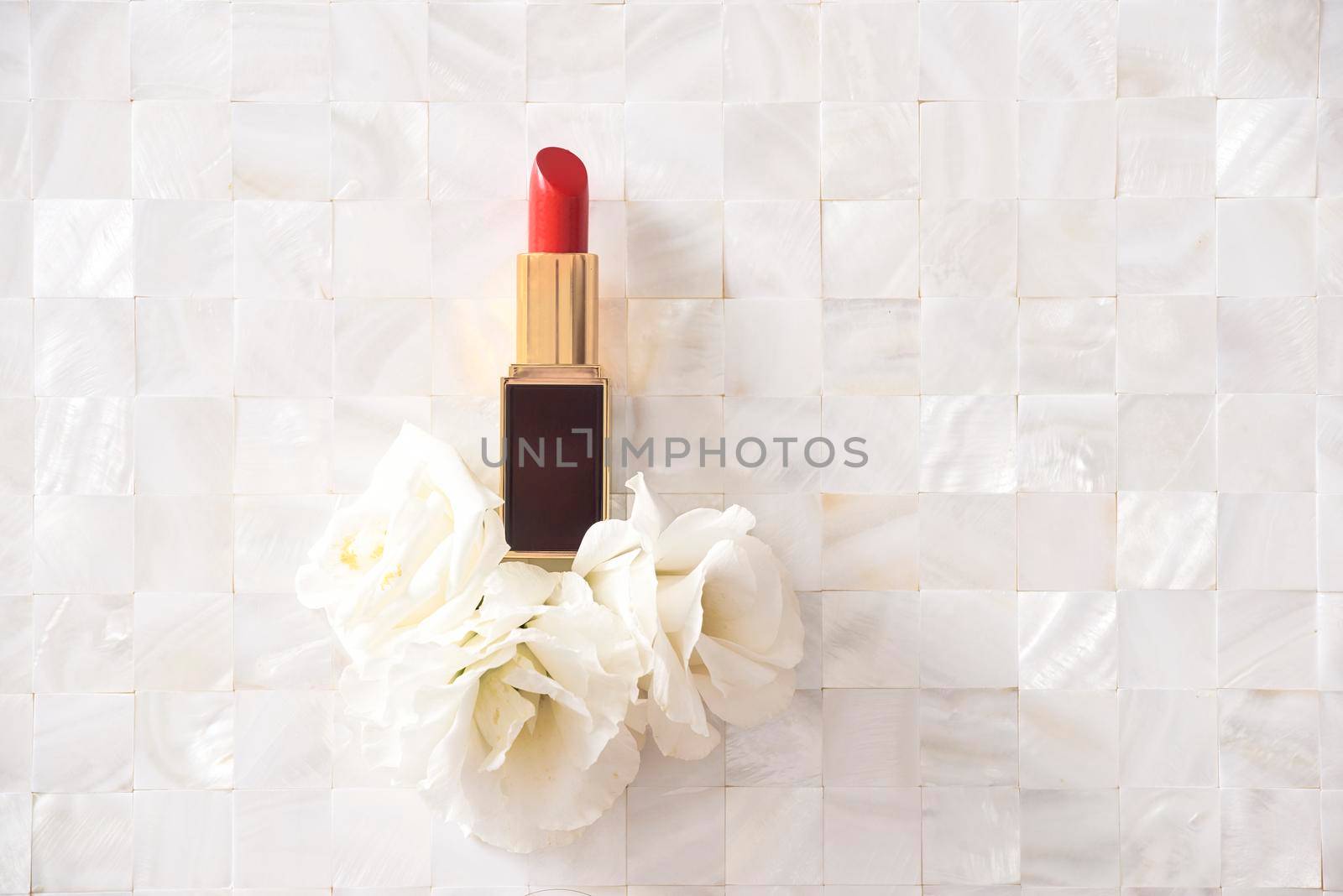 Lipstick with beautiful flowers on white background by makidotvn