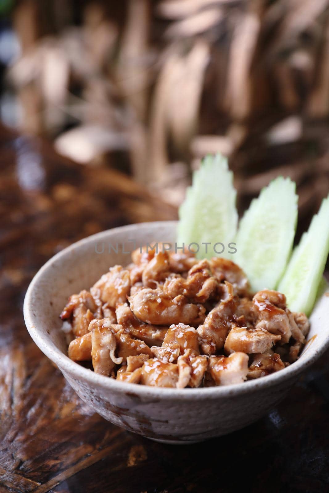 japanese food Chicken teriyoki with rice on wood background by piyato