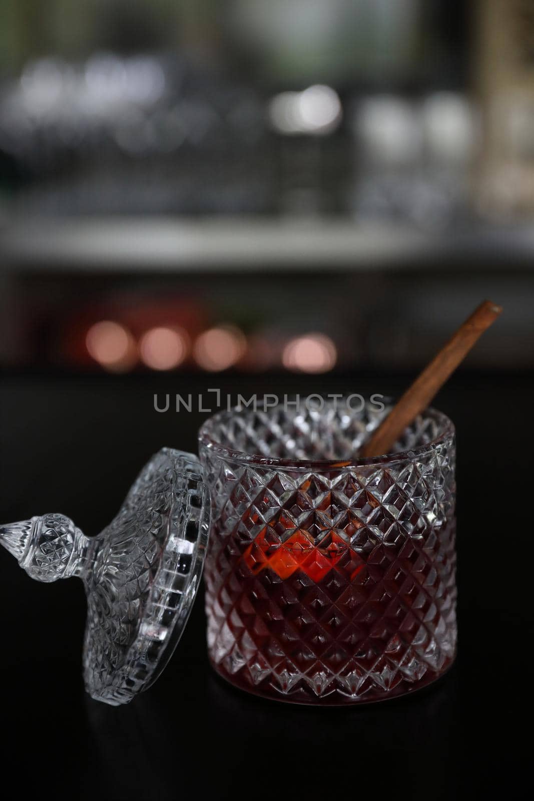 Pink Cocktail glass with ice at a bar counter by piyato