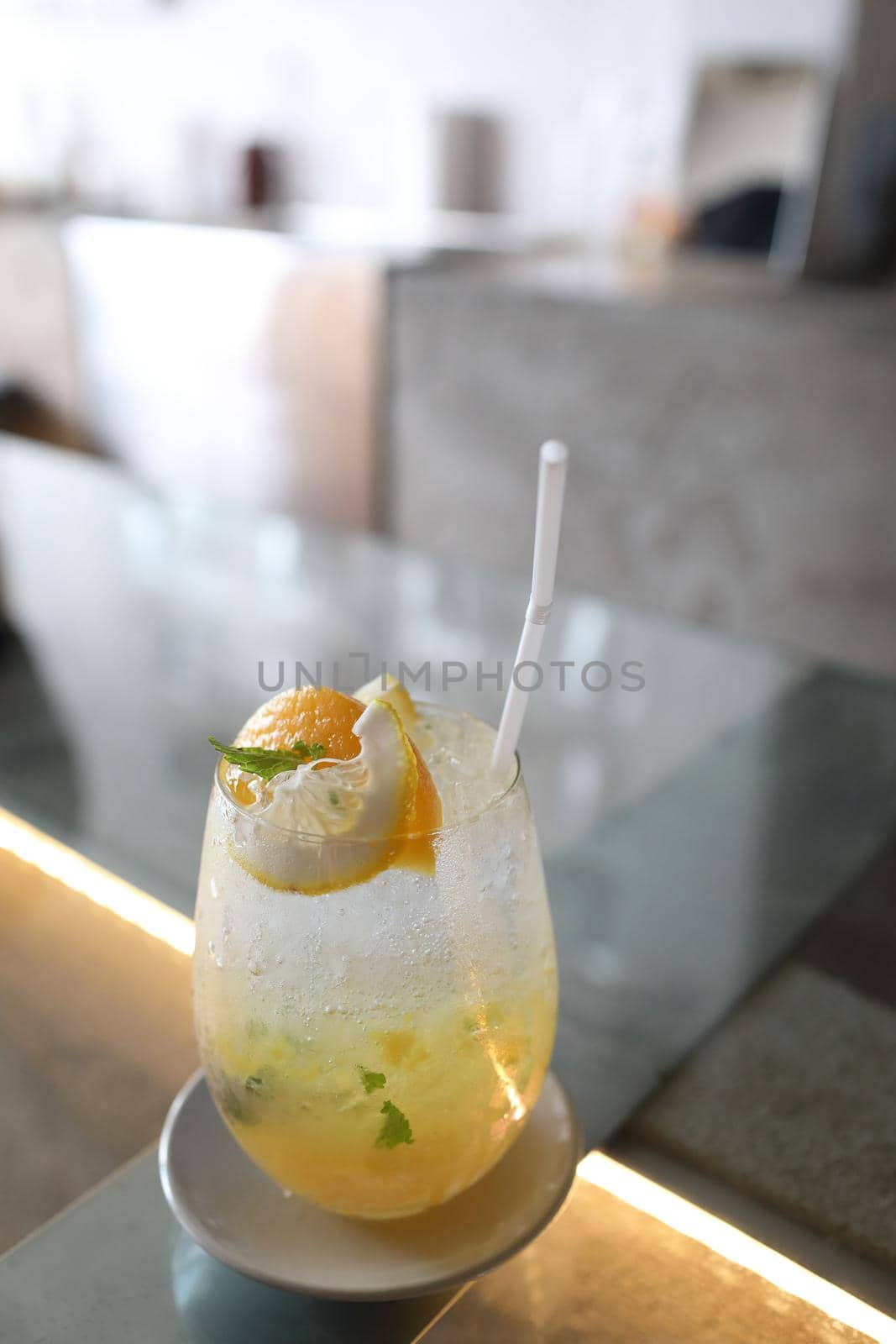 Yellow Cocktail glass with ice by piyato