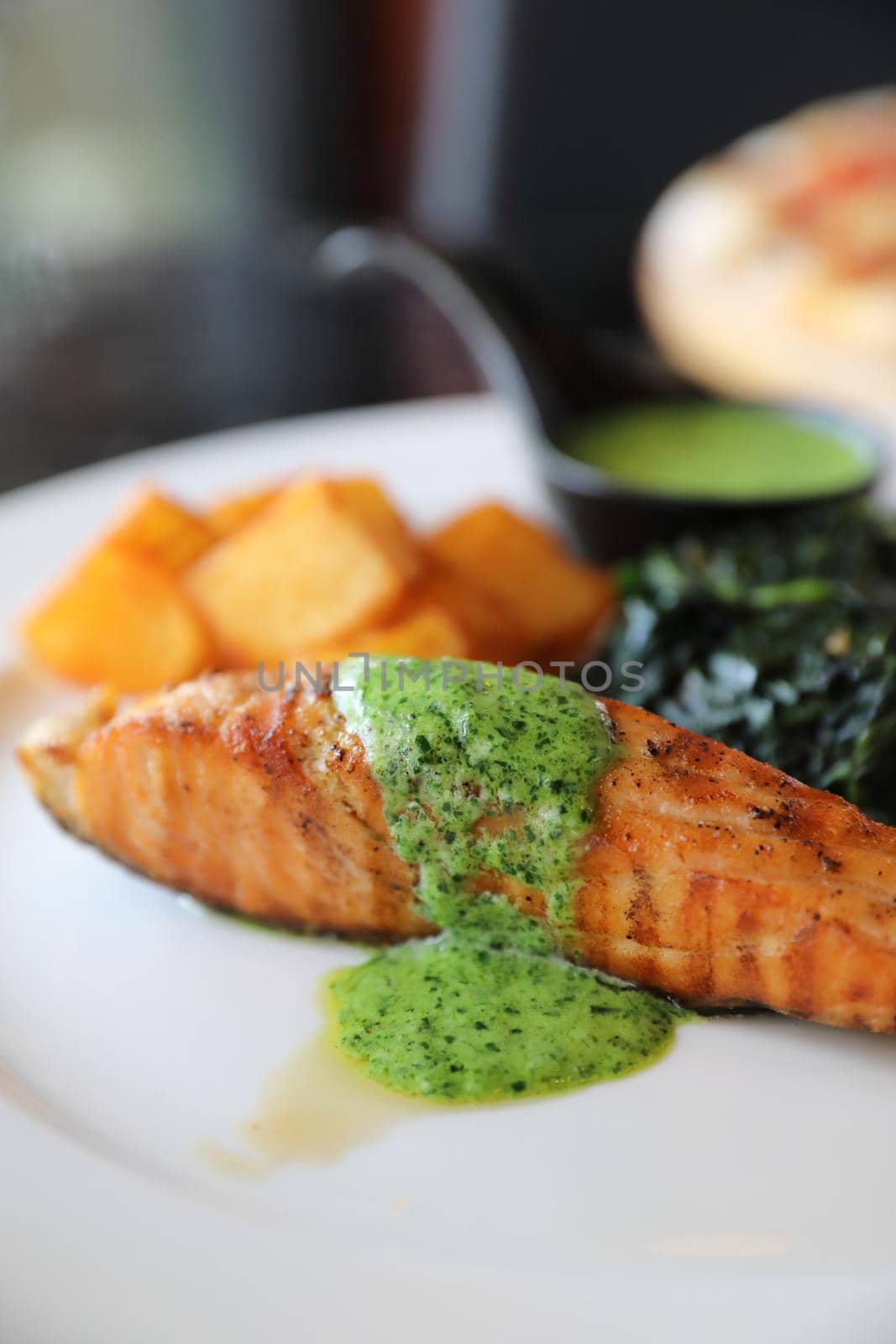 Salmon steak with pesto sauce by piyato