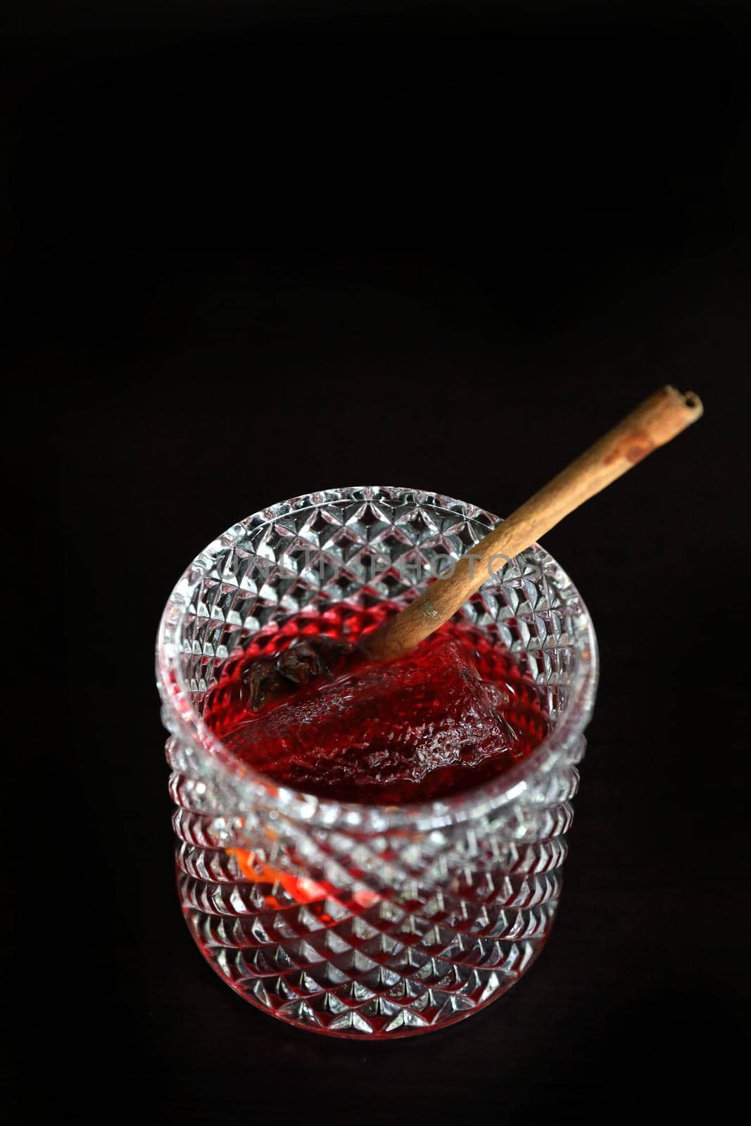 Pink Cocktail glass with ice at a bar counter by piyato