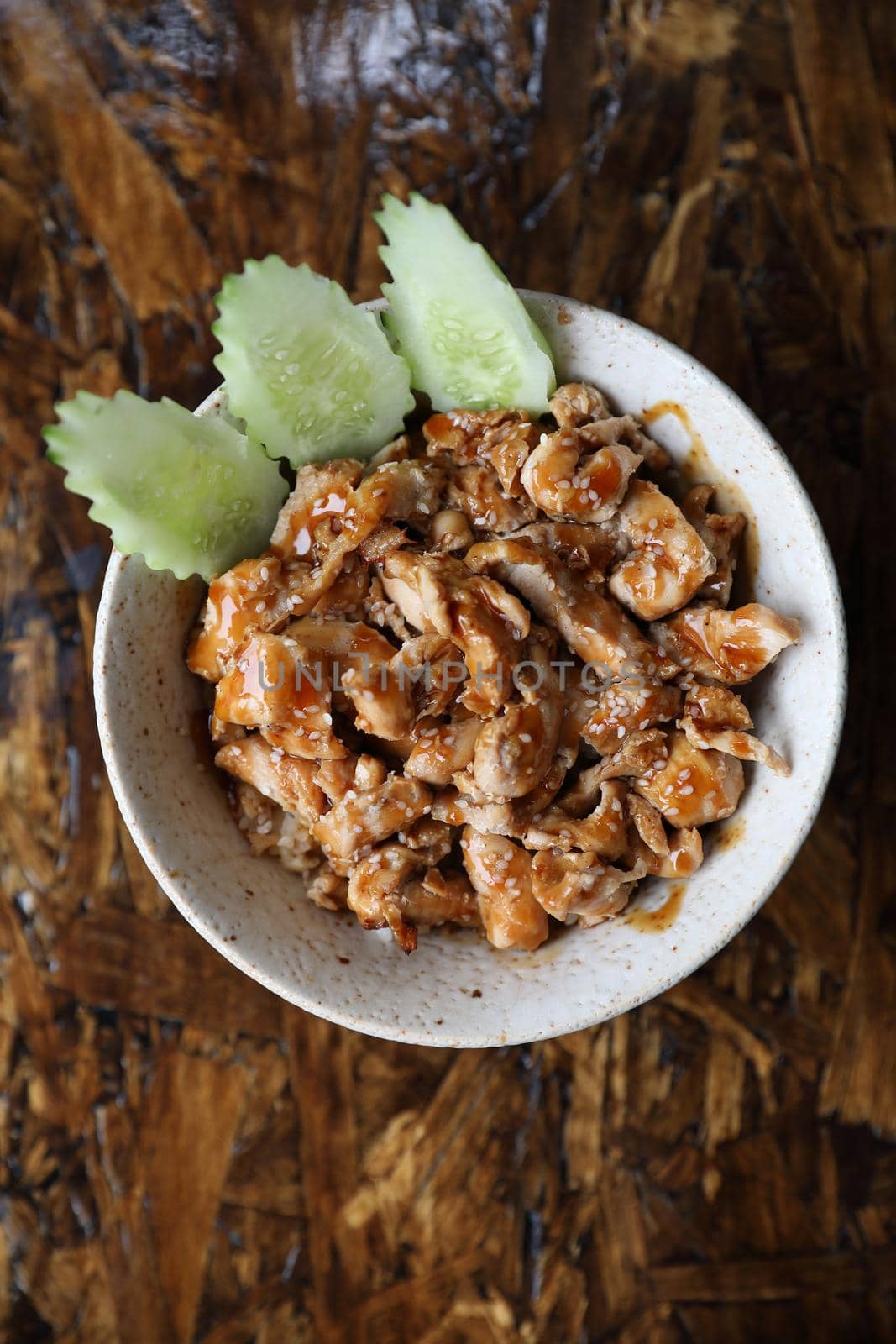 japanese food Chicken teriyoki with rice on wood background by piyato