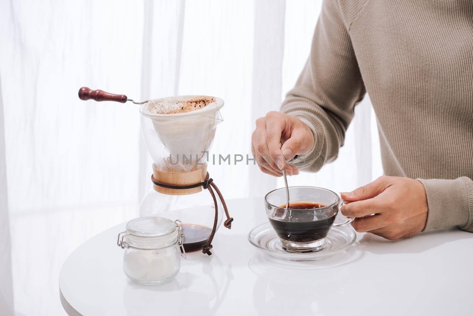 Young man enjoying coffee and breakfast at a cafe