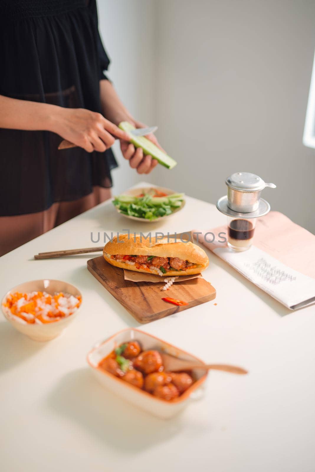 Meatballs served with tomato sauce as sandwich, Vietnamese breakfast