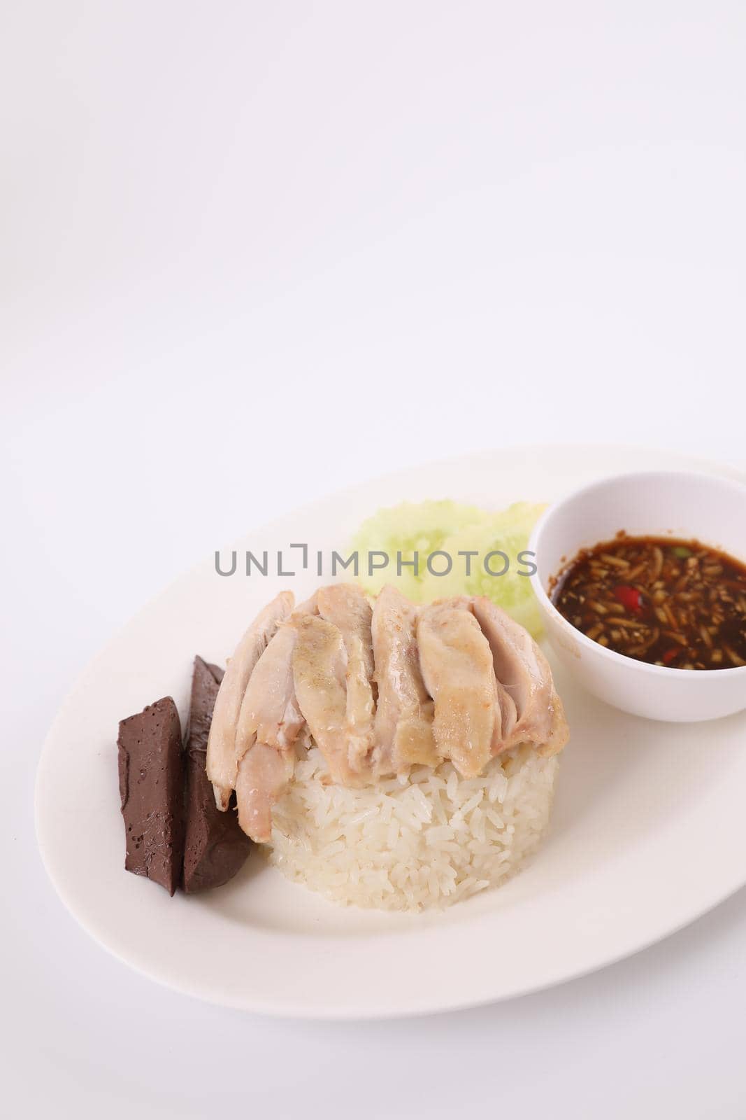 Thai food gourmet steamed chicken with rice , khao mun kai in wood background  by piyato