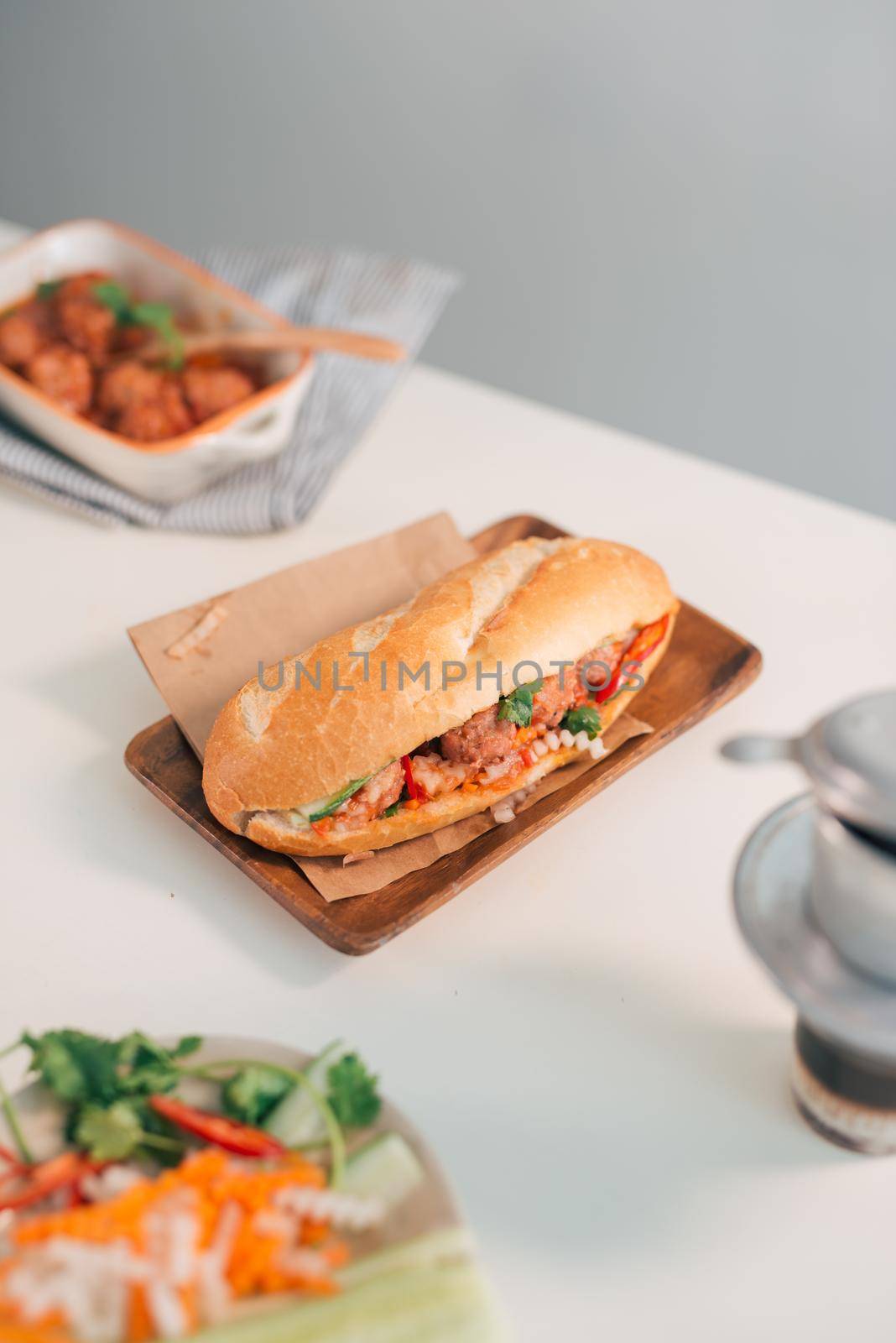 Banh Mi Xiu Mai is a popular pork ball sandwich with tomato sauce in Vietnam by makidotvn