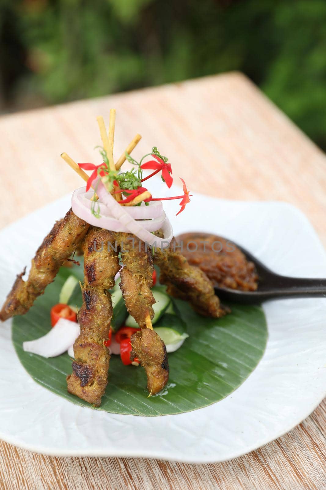 Chicken Satay on dark brown table street food appetizer by piyato