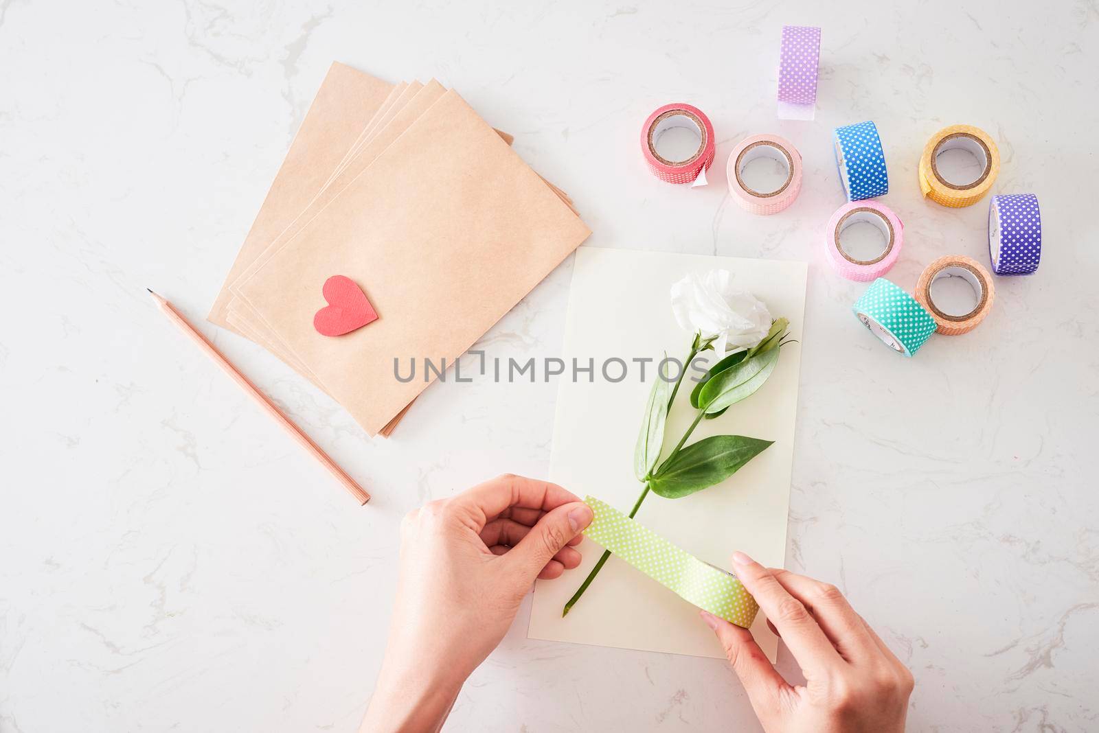 Making decorations or greeting card. Paper strips, flower, scissors. Handmade crafts on holiday: Birthday, Mother's or Father's Day, March 8, Wedding. 