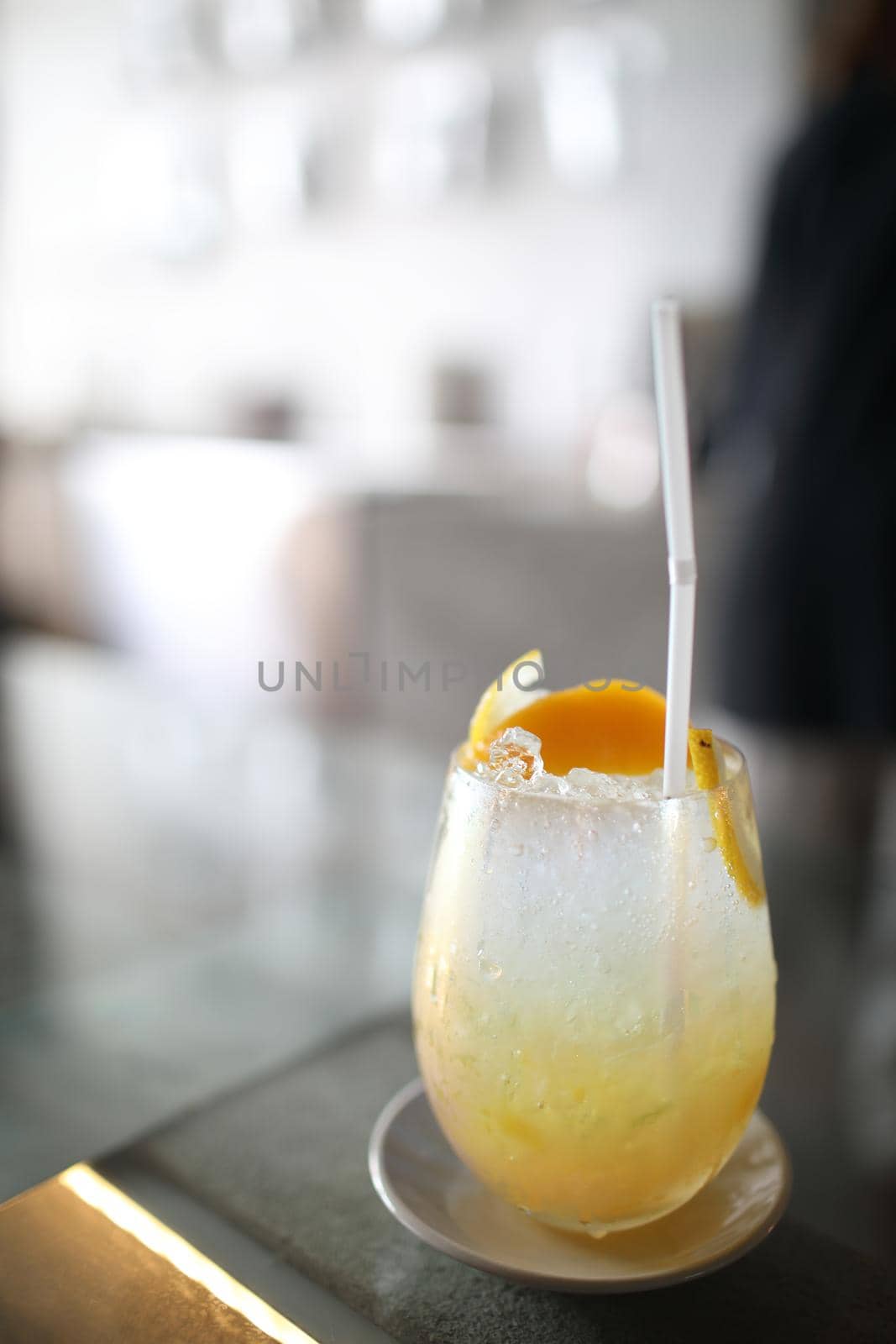 Yellow Cocktail glass with ice by piyato