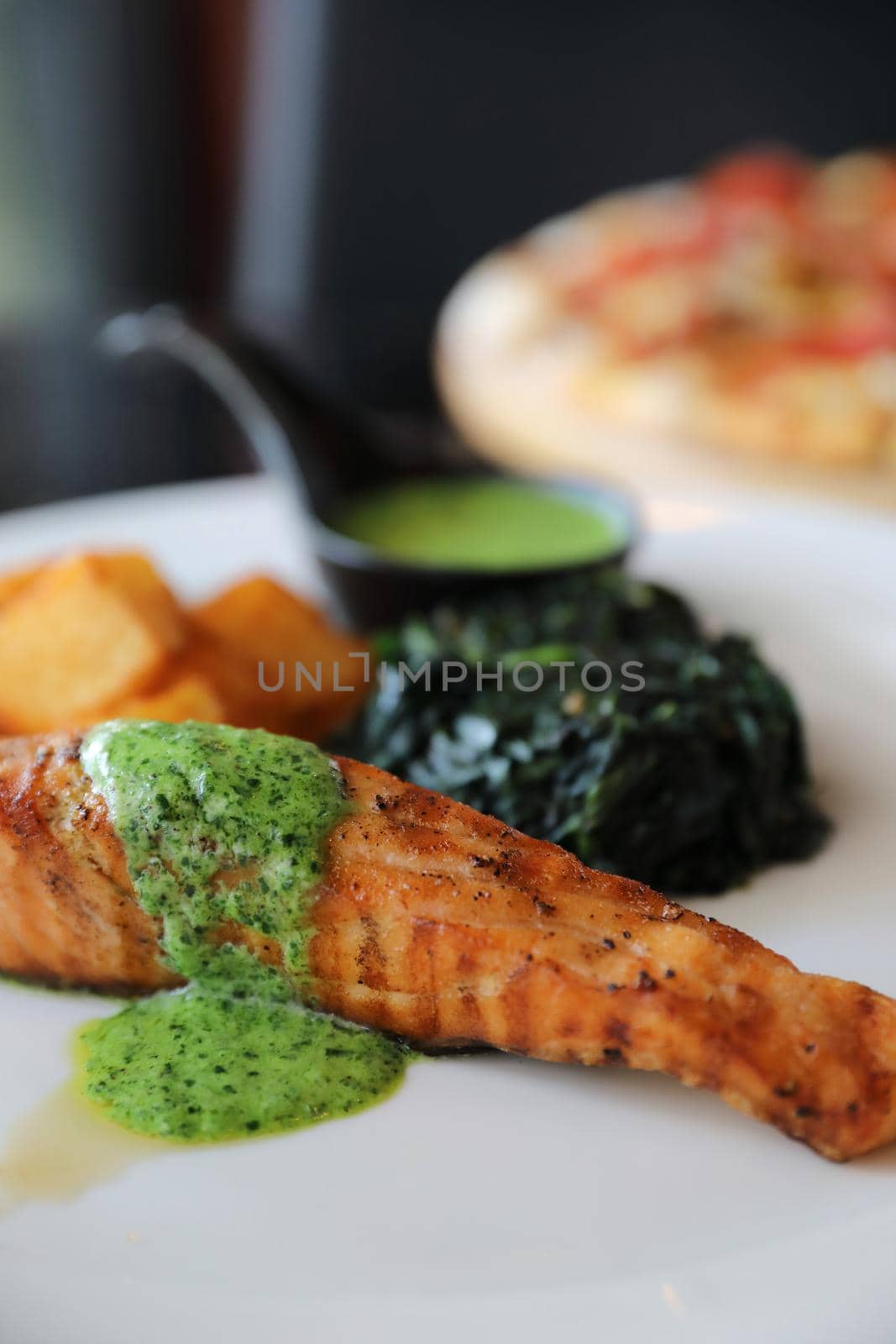 Salmon steak with pesto sauce by piyato