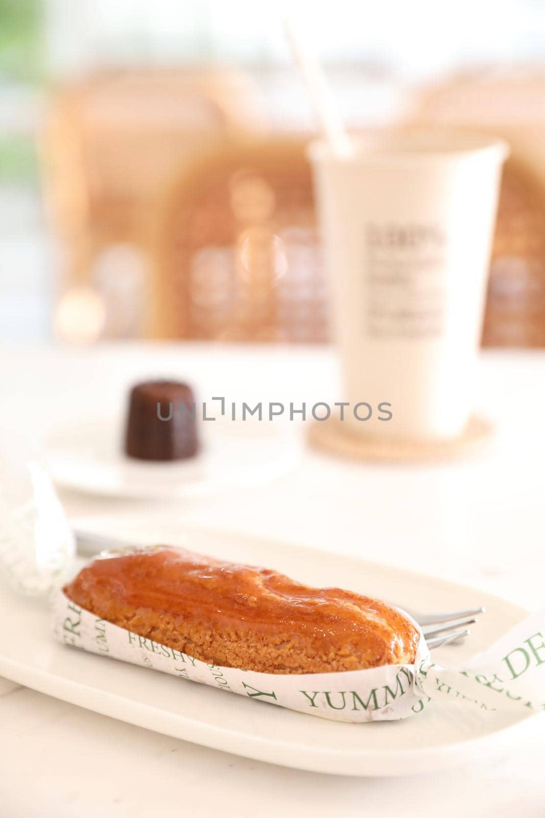 croquant choux cream japanese dessert in coffee shop background by piyato