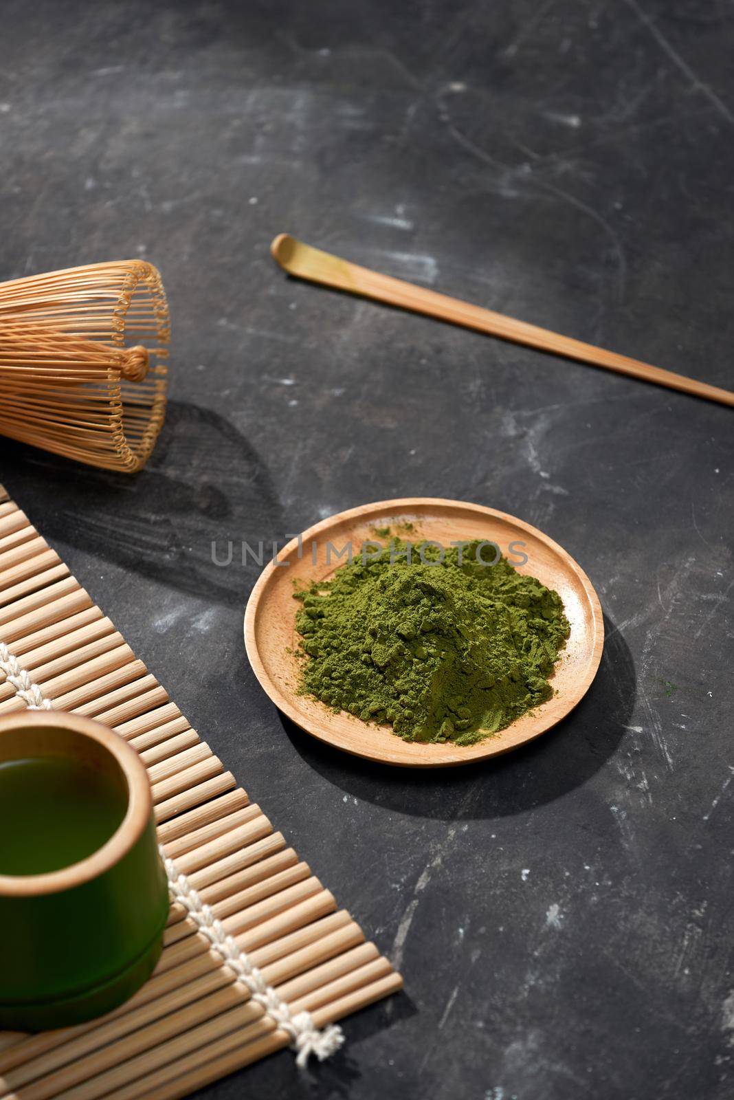 Organic Green Matcha Tea on wooden table, copyspace by makidotvn