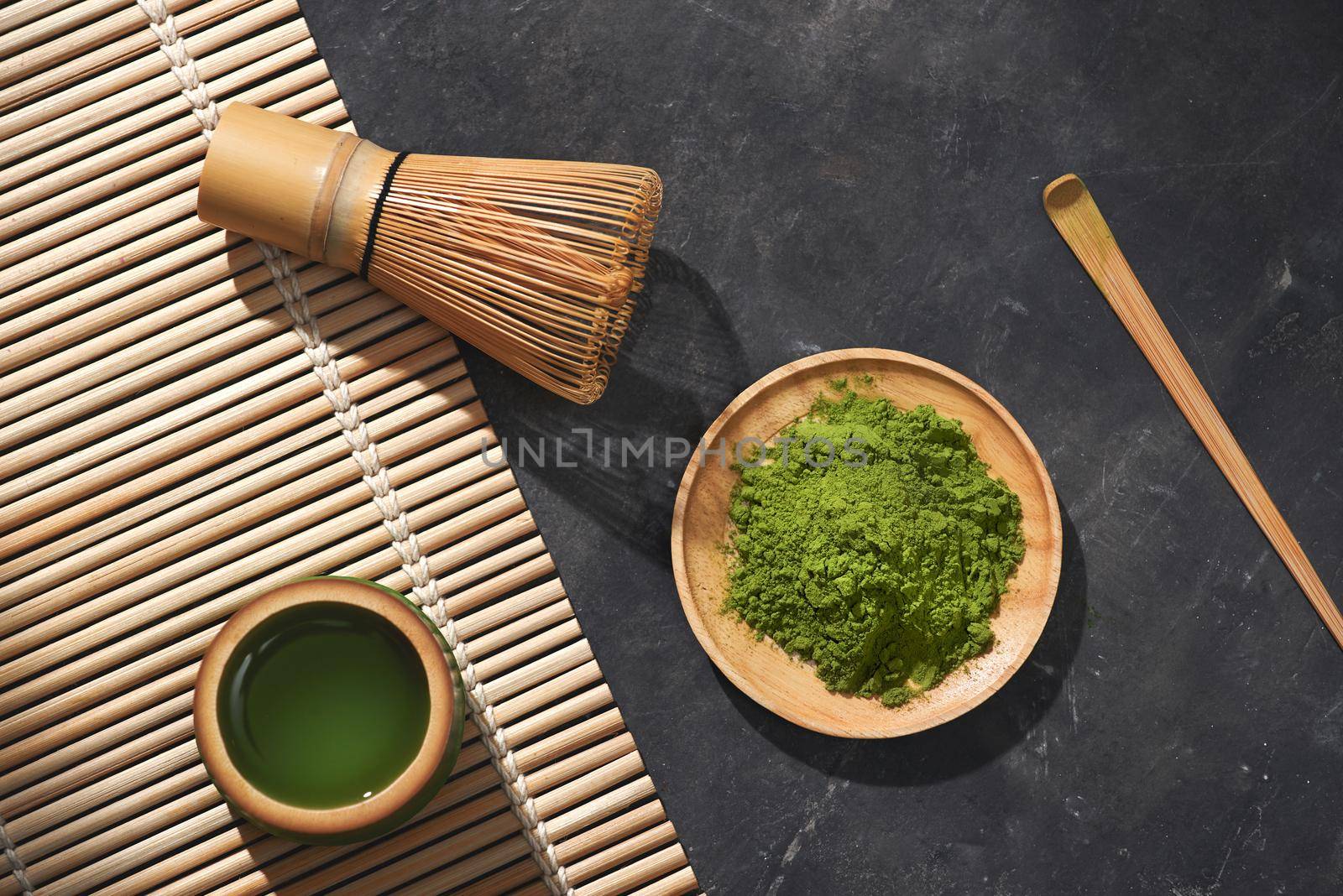 Organic Green Matcha Tea on wooden table, copyspace