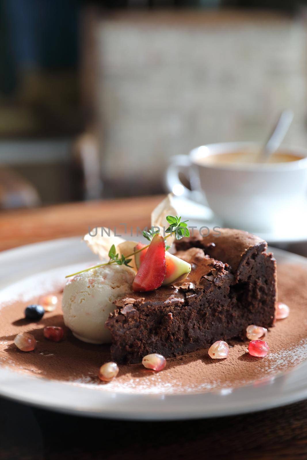 Chocolate cake with ice cream and coffee dessert on wood table  by piyato