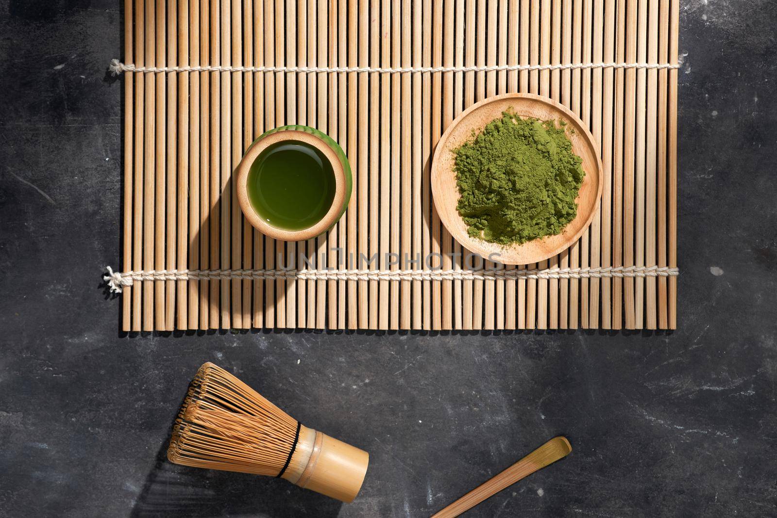 Organic Green Matcha Tea on wooden table, copyspace