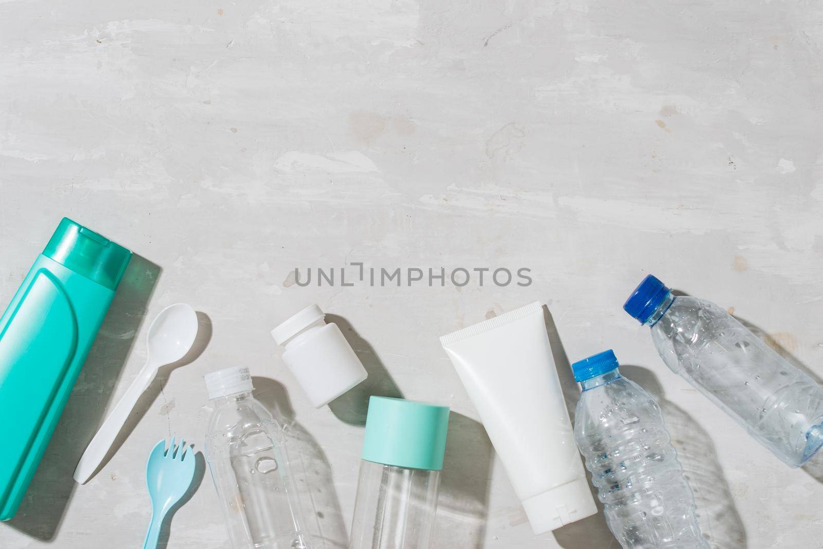 No plastic recycle concept white plastic dishes plates cups spoon isolated white background, copy space, top view
