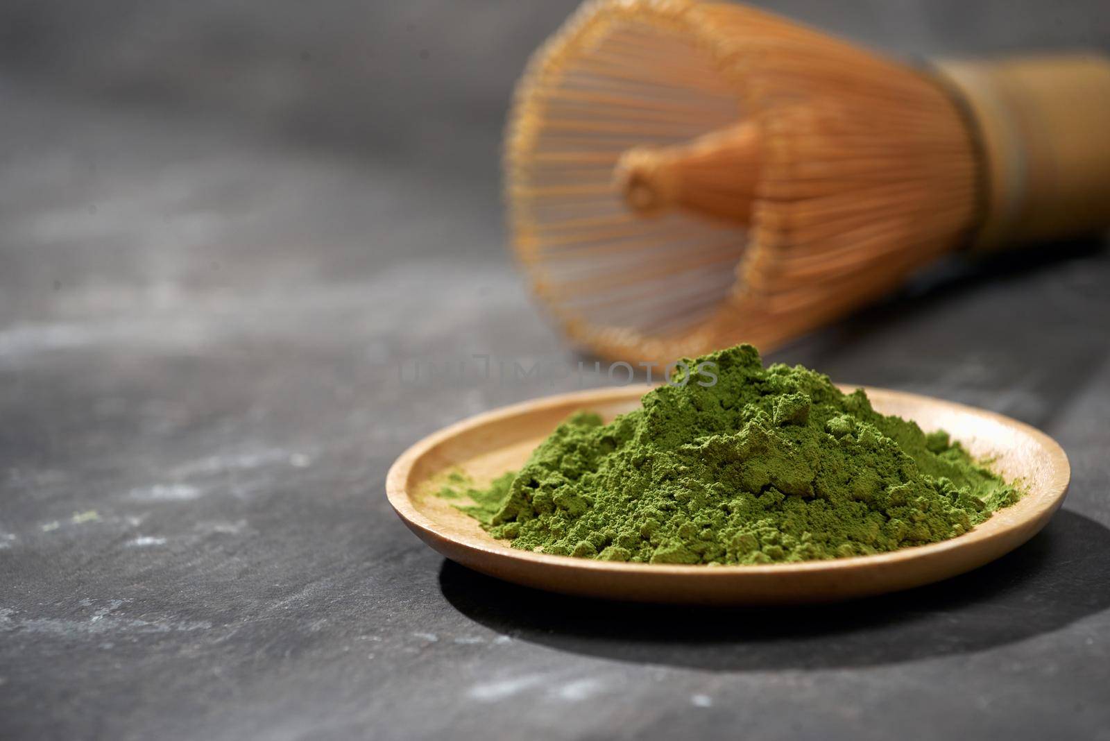 Organic Green Matcha Tea on wooden table, copyspace