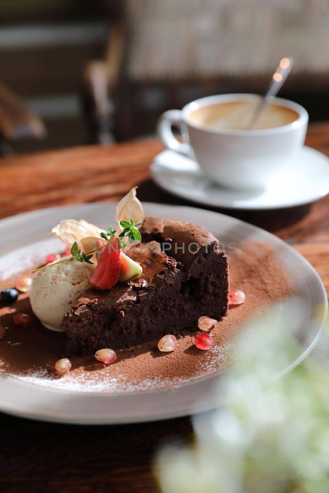 Chocolate cake with ice cream and coffee dessert on wood table  by piyato