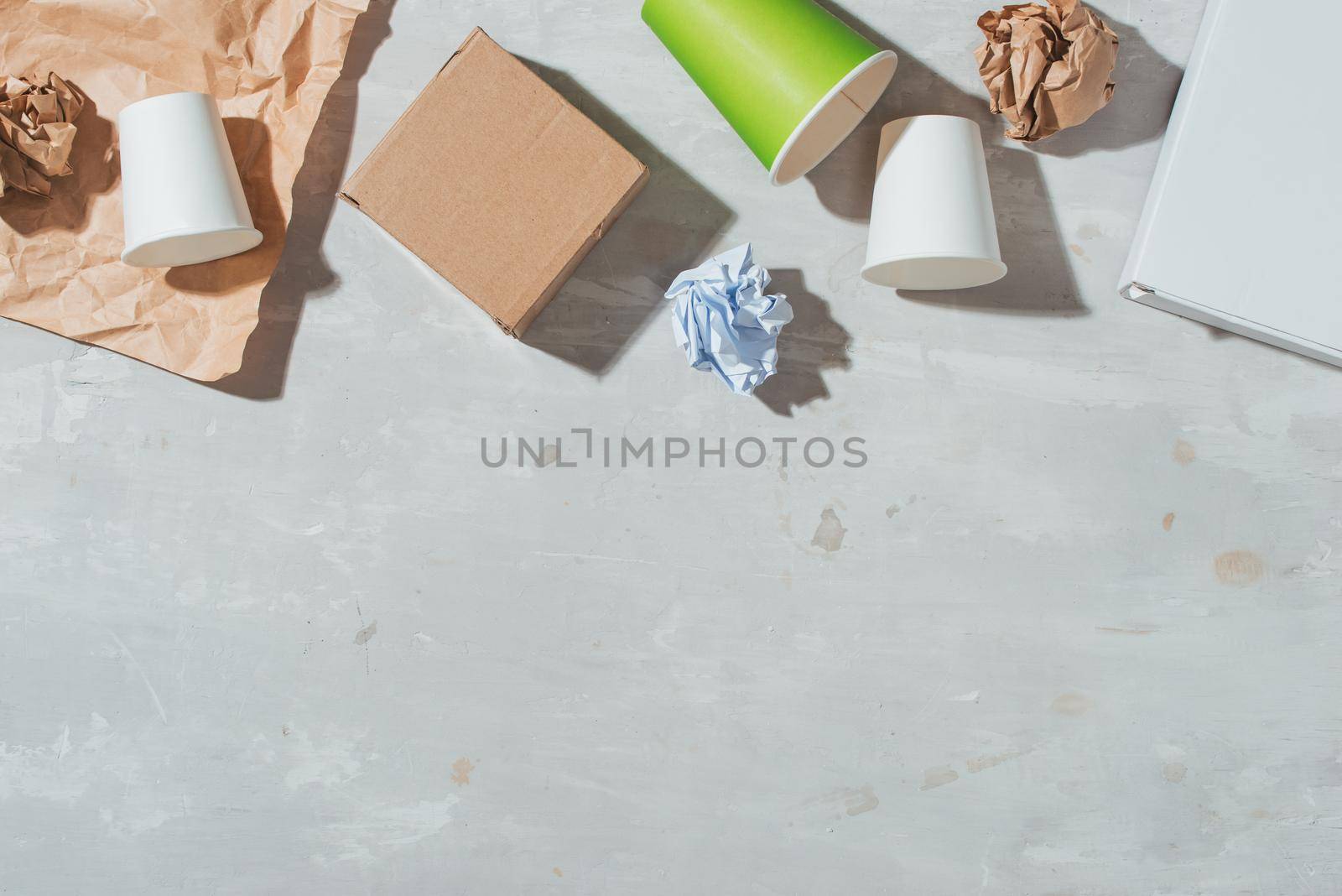 Separate garbage collection: paper bag, egg packing, paper cup. Eco concept. Flat lay by makidotvn