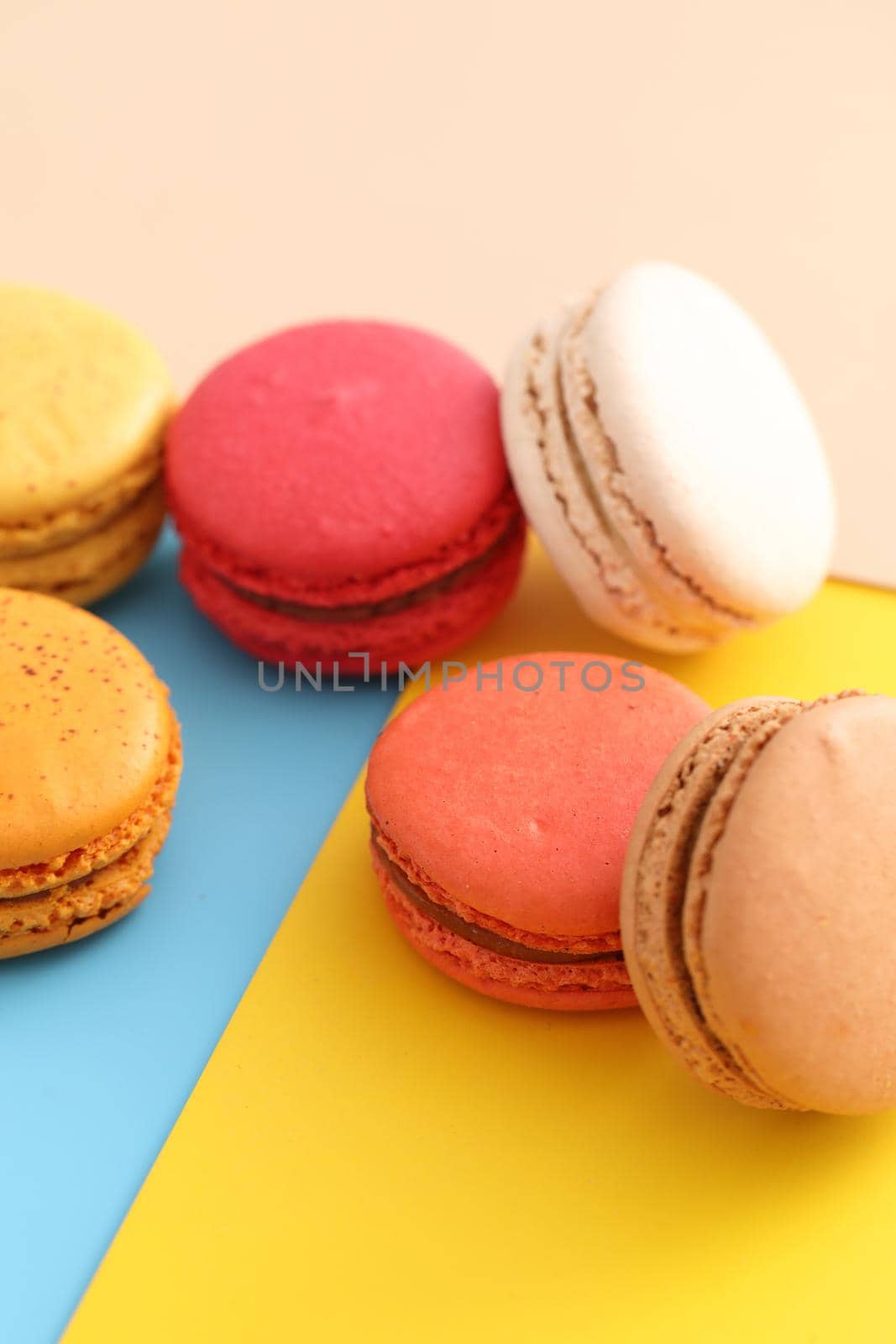 Colorful macarons isolated in pastel background by piyato