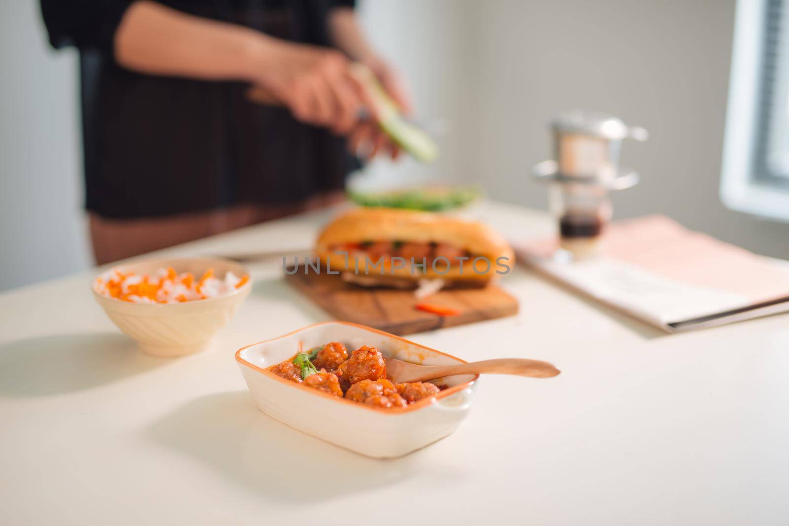 Meatballs served with tomato sauce as sandwich, Vietnamese breakfast