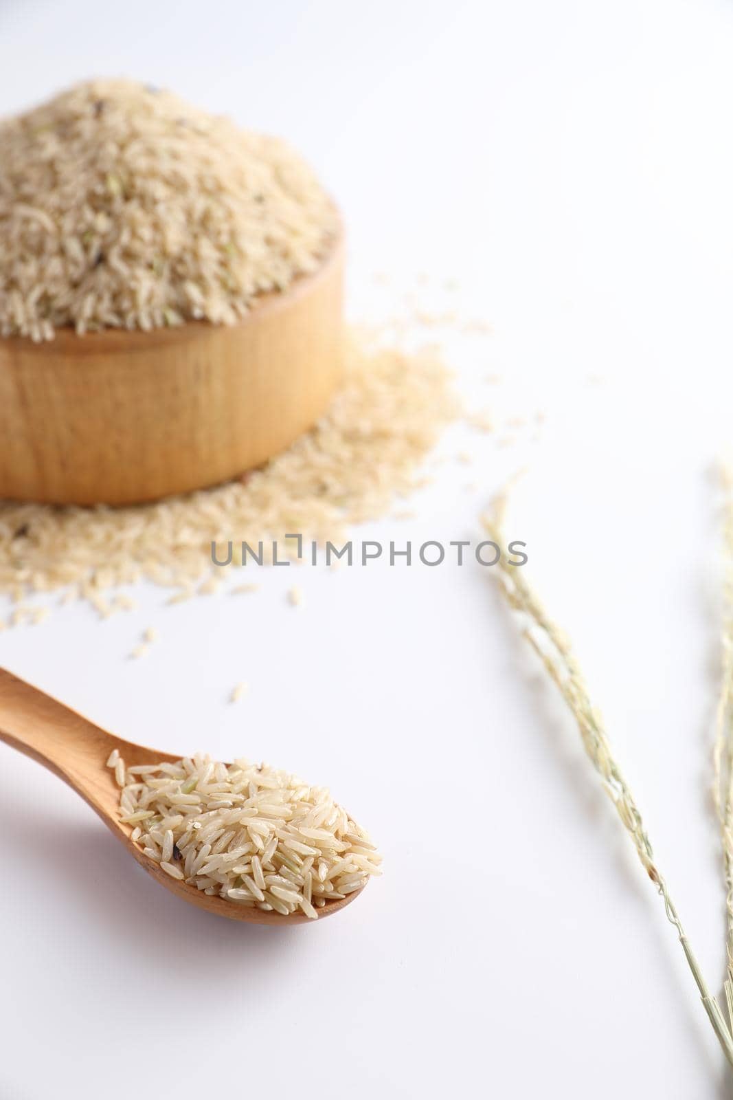 Organic raw brown rice in close up by piyato