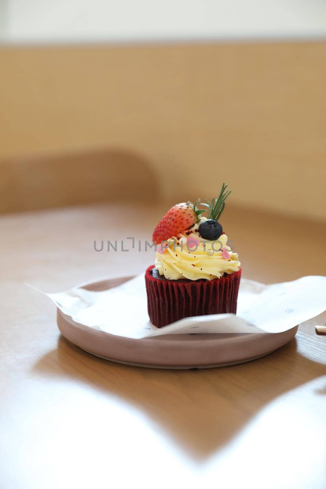 Colorful cupcakes on wood table background