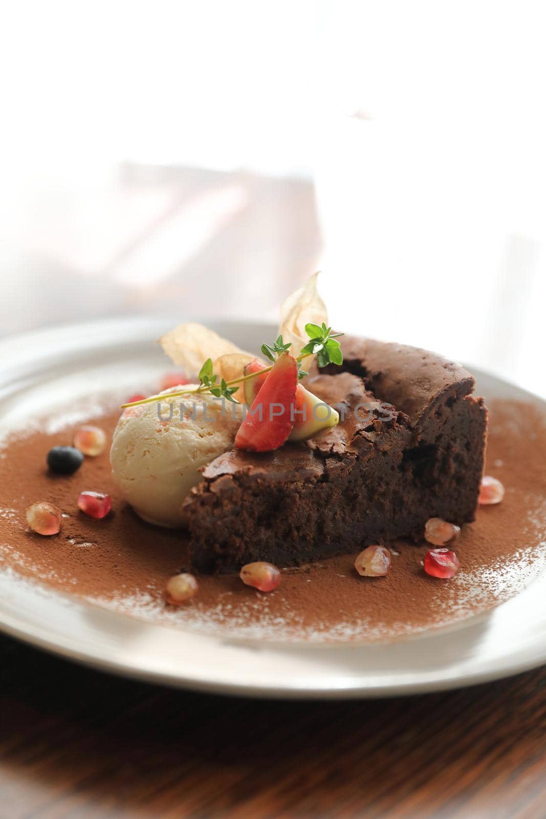 Chocolate cake with ice cream dessert on wood table 