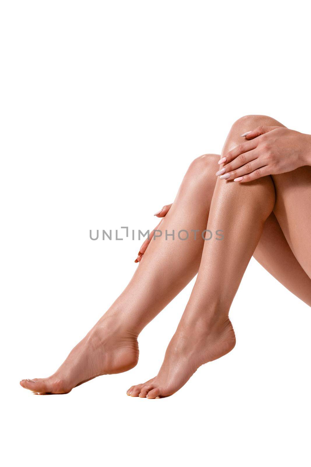 Long pretty woman legs, isolated on white. Healthy lifestyle, sport, healthcare, nutrition and diet concept.