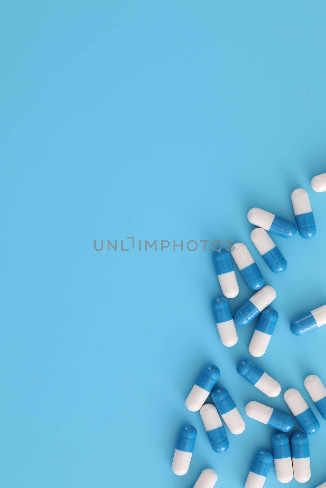 pills capsules isolated on blue background