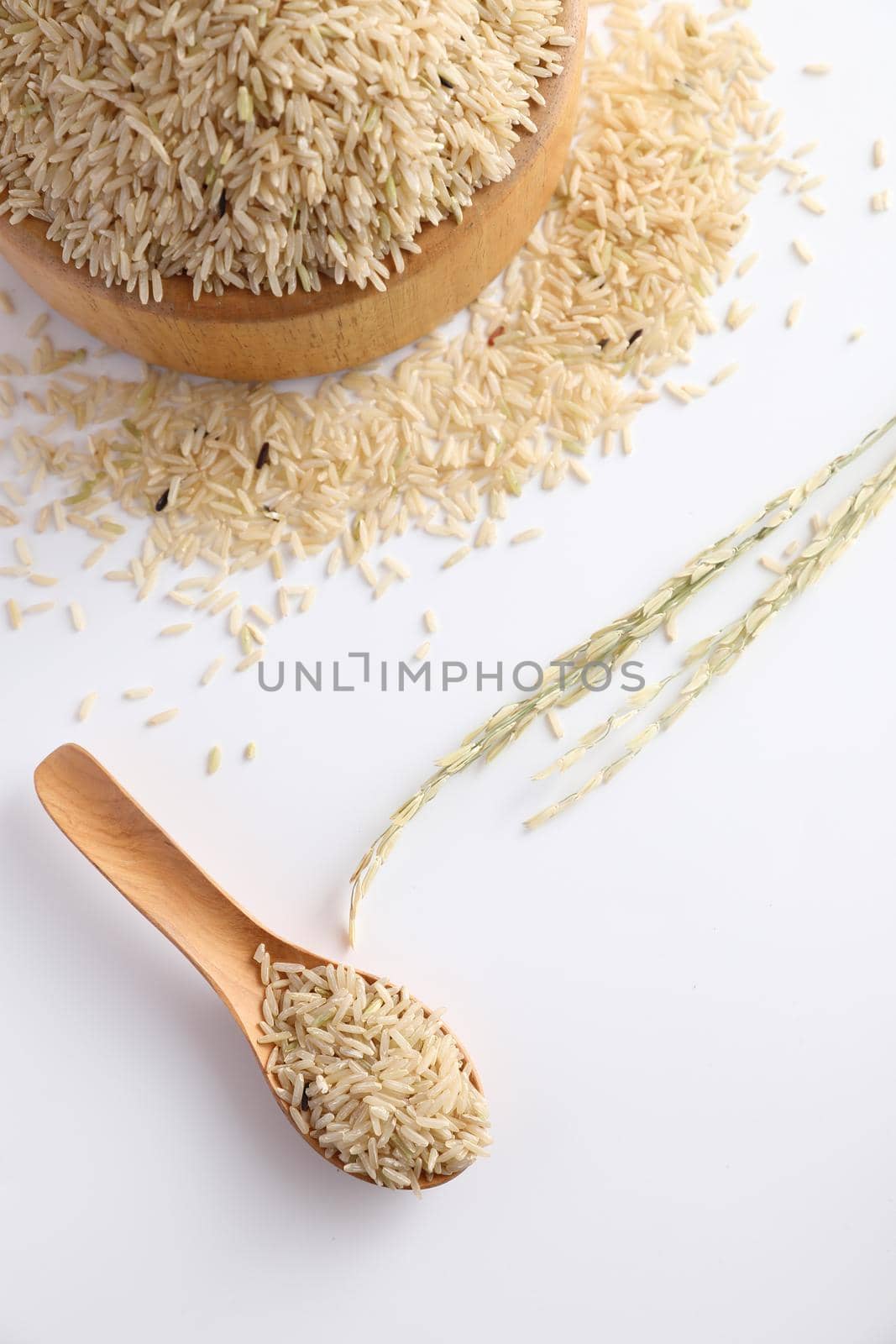 Organic raw brown rice in close up by piyato
