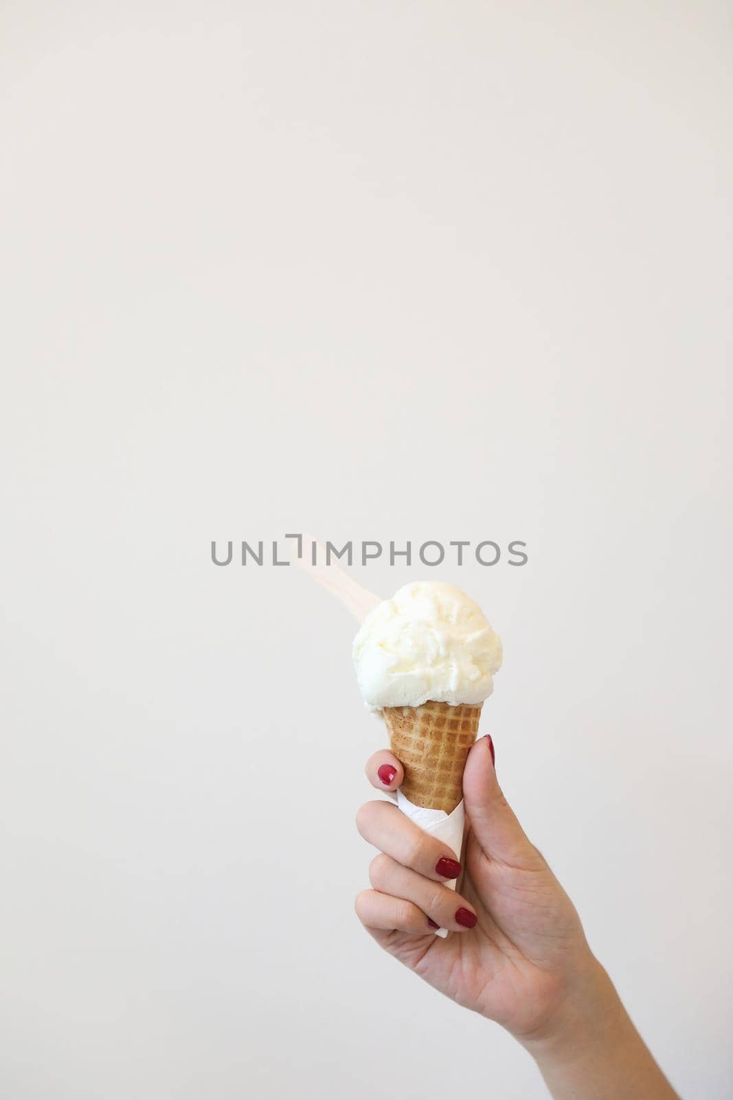 Woman hand with ice cream in close up