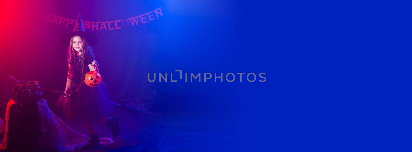 Banner funny child girl in witch costume for Halloween with pumpkin Jack copy space by Satura86