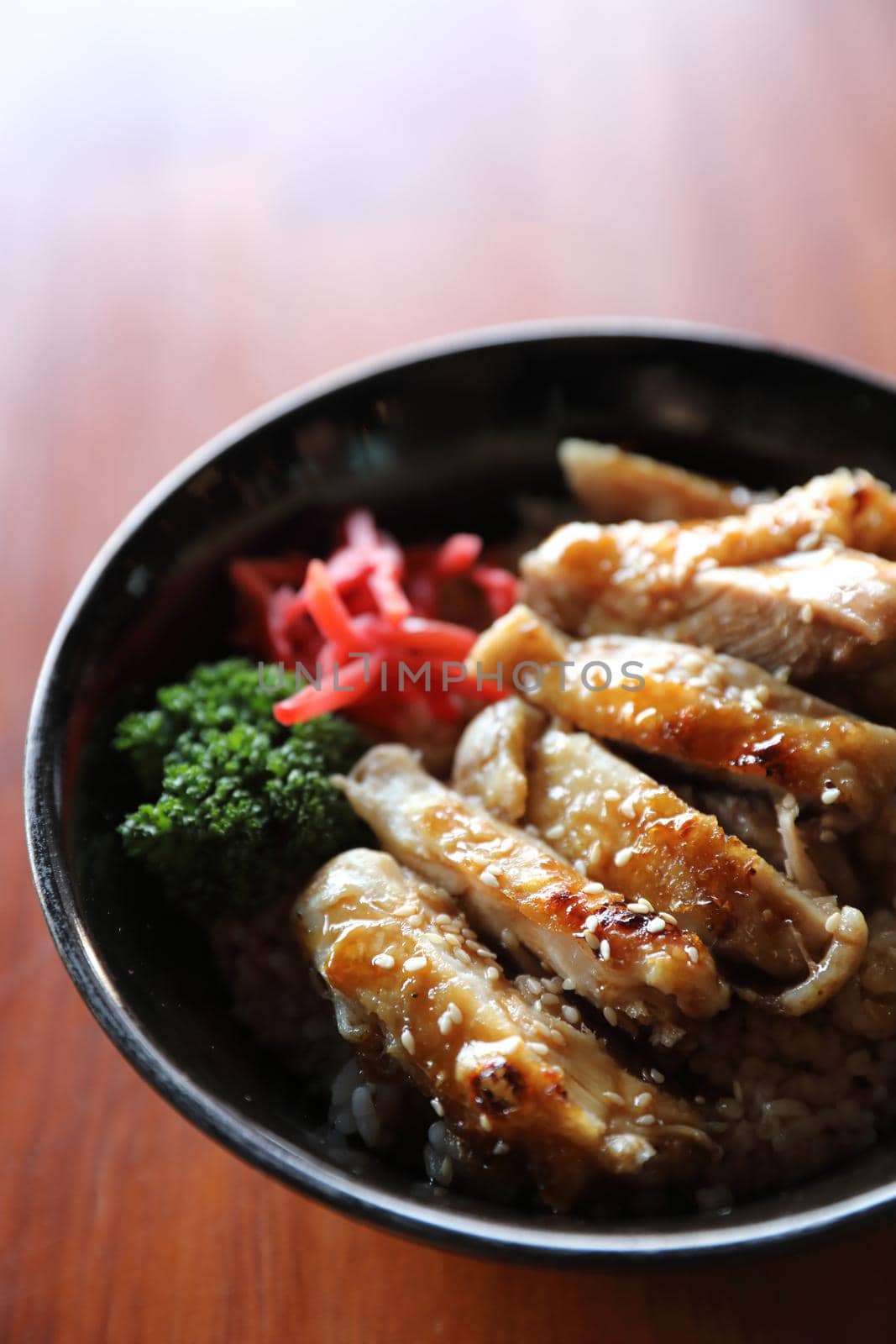 japanese food Chicken teriyaki with rice on wood background by piyato