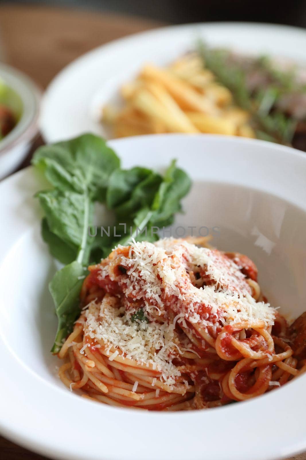spaghetti Bolognese with italian sausage and tomato sauce with parmesan cheese and basil  by piyato